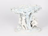 porcelain figurine of a tree with two figures in it