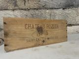 a wooden sign that says chateau rozierr on it