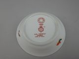 a white plate with a red and yellow design on it