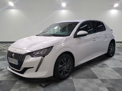 the white car is parked on a checkered floor in a room