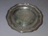 a silver plate that is sitting on a table