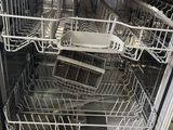 a dishwasher that has a lot of dishes inside of it