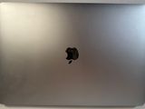 an apple macbook pro laptop computer sitting on top of a white table