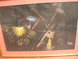 framed picture of a painting of a man and a woman on a stage