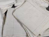 a lot of white linens on a table