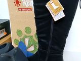 a pair of boots that are next to a box