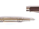 two pens that are sitting next to each other on a white surface