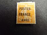 an orange stamp with a picture of a woman on it