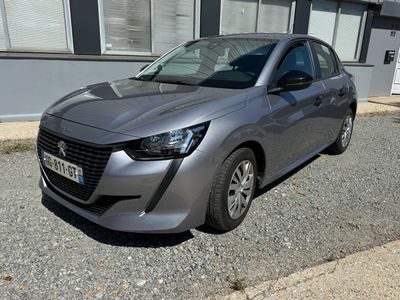 a silver car that is parked in front of a building