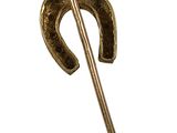 a gold cane with a horseshoe shaped handle on a white background