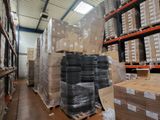 a large warehouse filled with lots of boxes and pallets