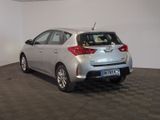 a silver car that is parked in a room