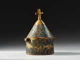 an image of a blue and gold covered box with a cross on top