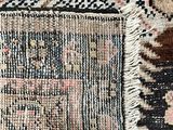 an image of a close up of a rug with a cat laying on it