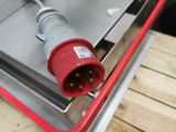 a close up of a red and grey electrical outlet