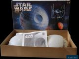 a box with three balls in it and a box with a picture of a star wars tier