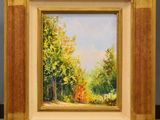 une peinture à l'huile représentant une scène forestière, dans un cadre doré