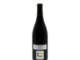a bottle of wine that is sitting on a table