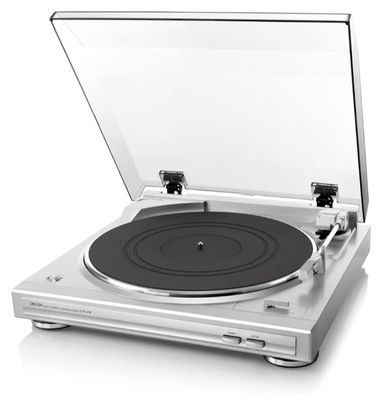 un gros plan d'un tourne-disque posé sur une surface blanche