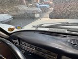 dashboard of a car with a bunch of cars in the background