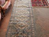 a long rug on the floor in a room