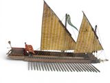 a model of a boat with a man on it
