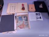 many books on a table with pictures on them