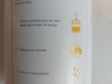 a bottle of orange juice sitting on a table