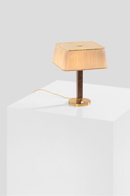 an image of a wooden table lamp on a white surface