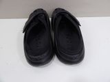 pair of black shoes sitting on top of a white table