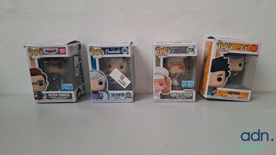 four pop vinyl figures are lined up in a row on a table