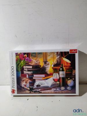 jigsaw puzzle box with a picture of a cat and a glass of wine on a table