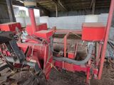 a red machine that is sitting inside of a building