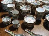 a lot of plates and spoons on the table