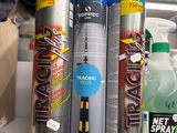 many different types of spray paint on a shelf