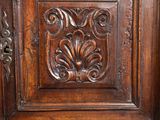 an image of a close up of a wooden cabinet with carvings on it