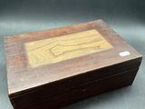 an old wooden box sitting on top of a table