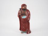 an image of a figurine of a man in a red robe
