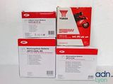 three boxes of yamaha motorcycle maintenance kits sitting on top of each other