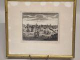 framed picture of a view of a city with buildings and a river