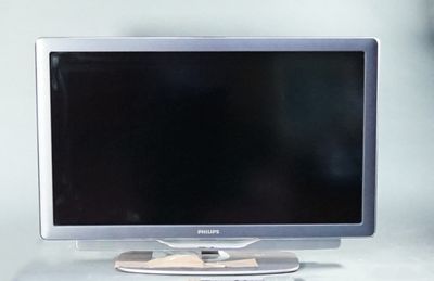 a computer monitor sitting on top of a white desk