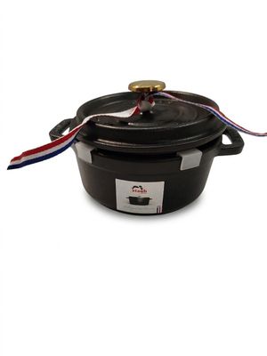a close up of a black pot with a red, white and blue ribbon on it