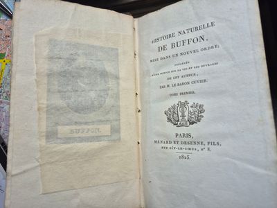 an open book with a picture of a man on it