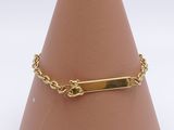 gold plated bracelet with a bar on a chain on a cone