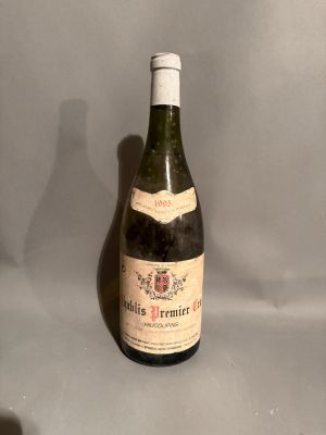 a bottle of wine that is sitting on a table