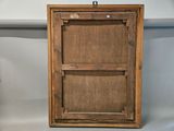 an old wooden picture frame with a picture hanging on the wall