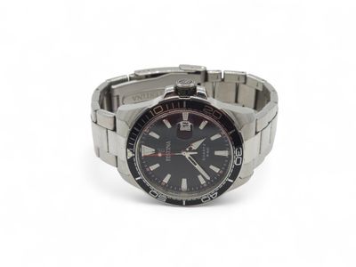 a close up of a watch on a white surface with a white background