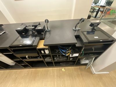 a picture of a desk with a lot of electronics on top of it