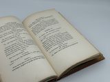 an open book on a table with a white background