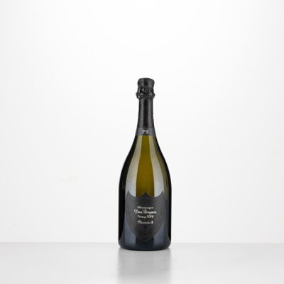 a bottle of champagne sitting on top of a white table